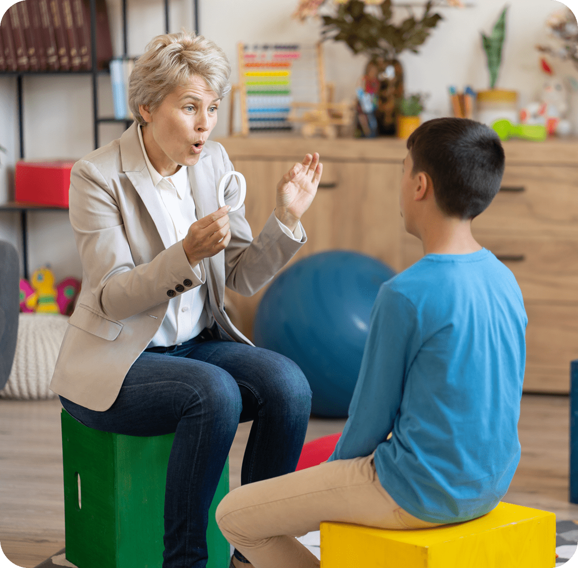 Therapist using tools with young boy