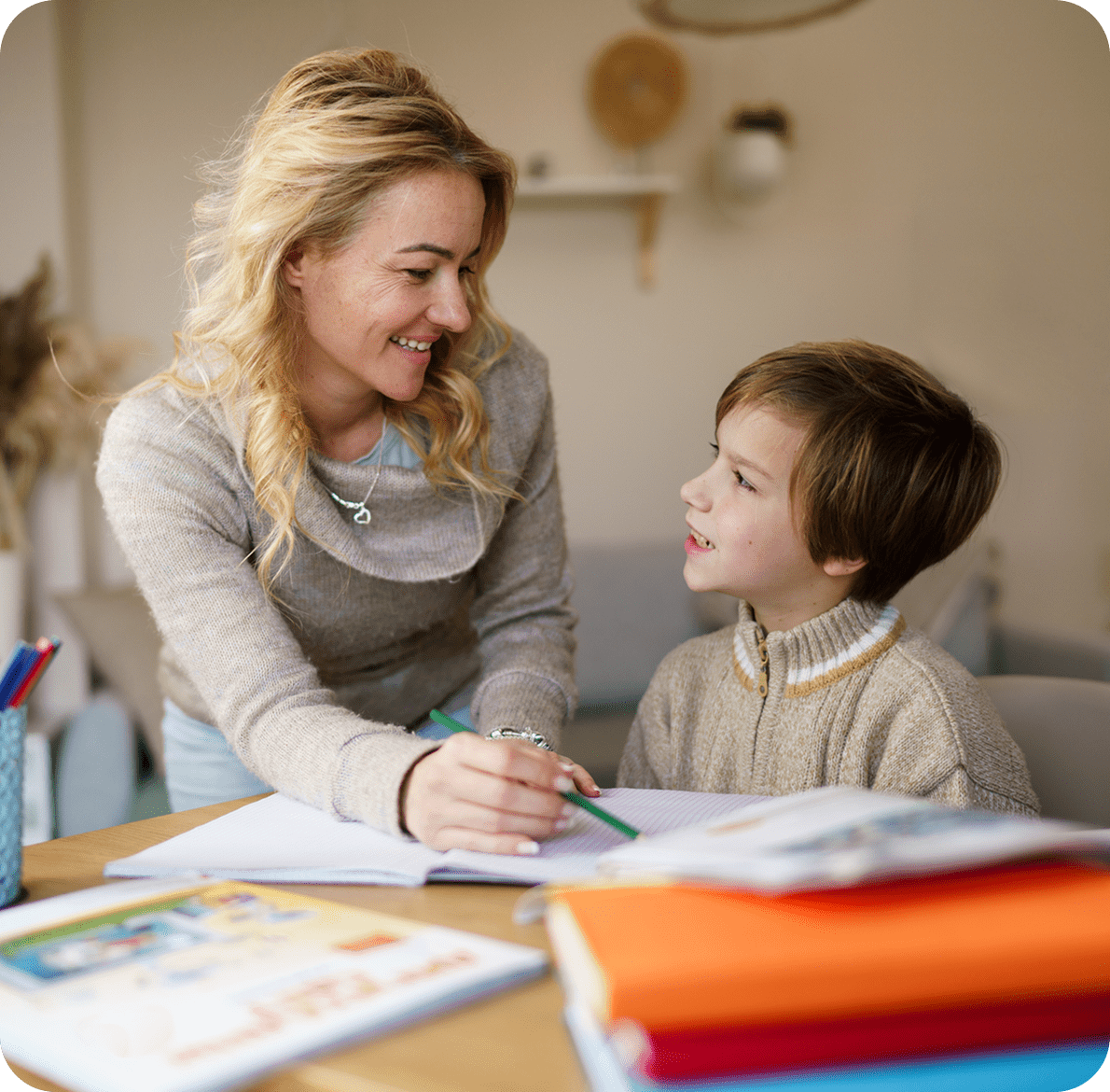 Mother and son doing schoolwork