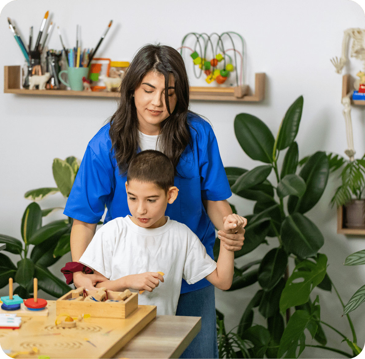 Woman assisting child with educational activity