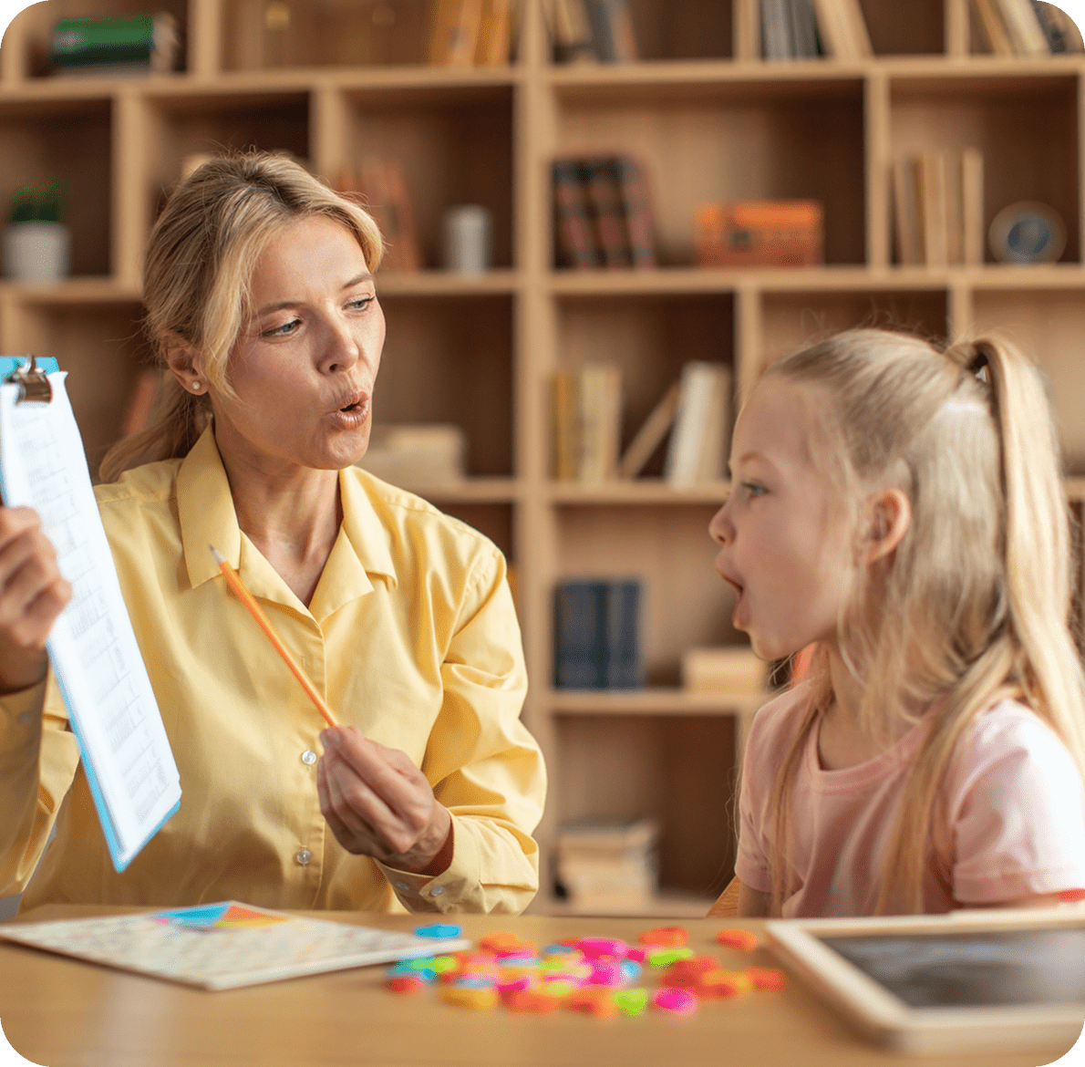 Speech therapy session with teacher and child