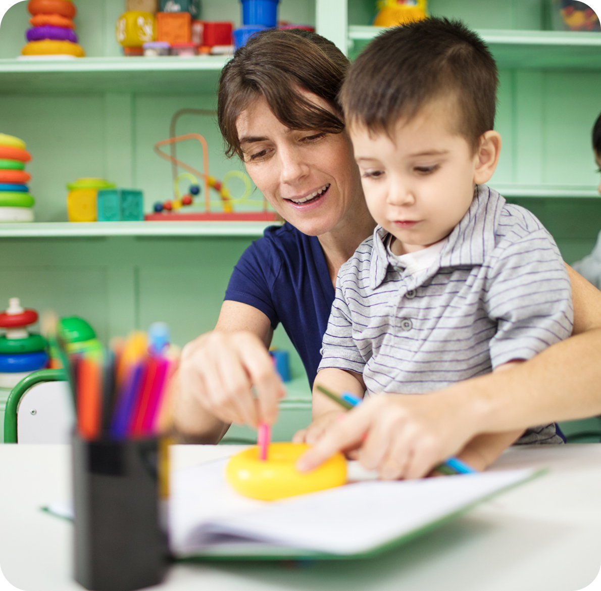 Child learning with teacher's guidance