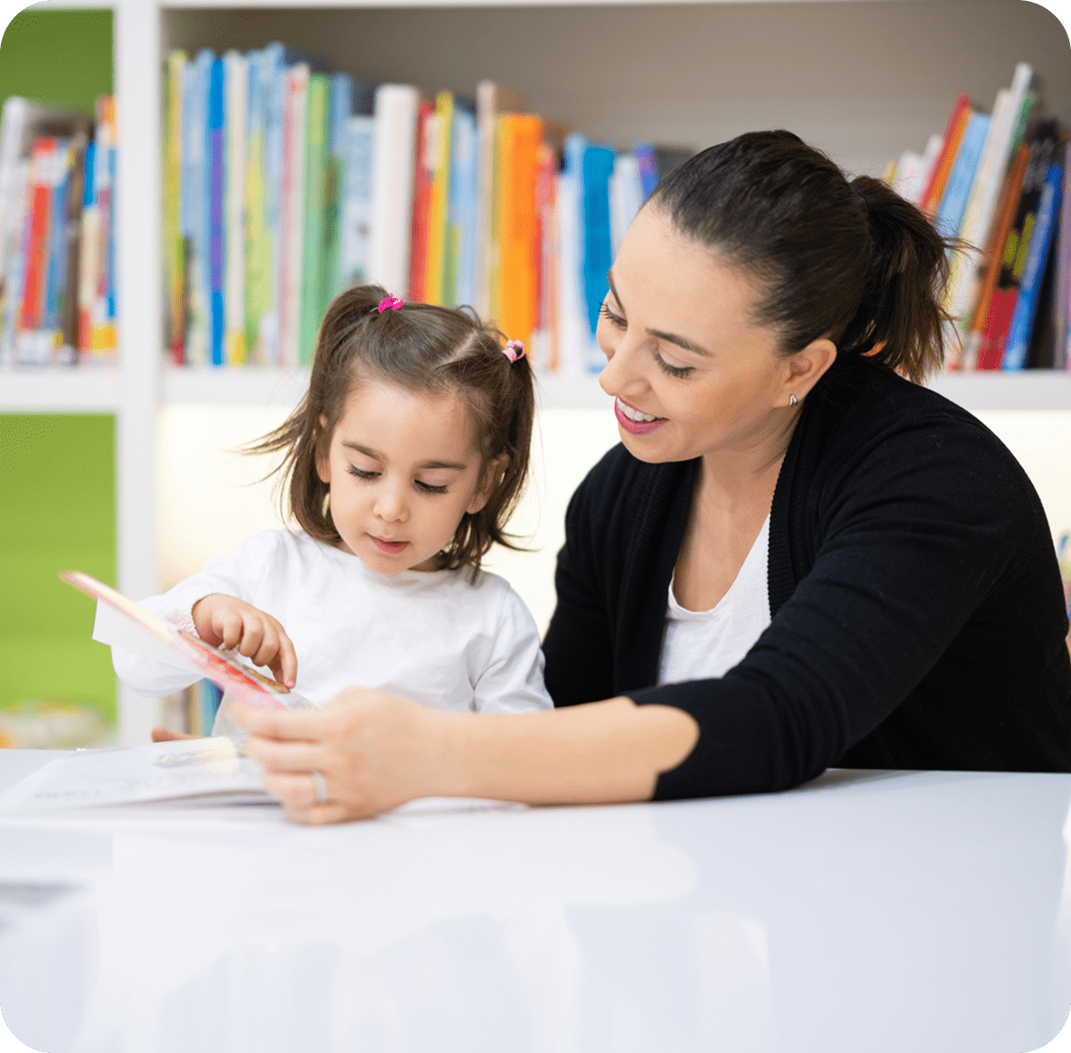 Adult and child reading together