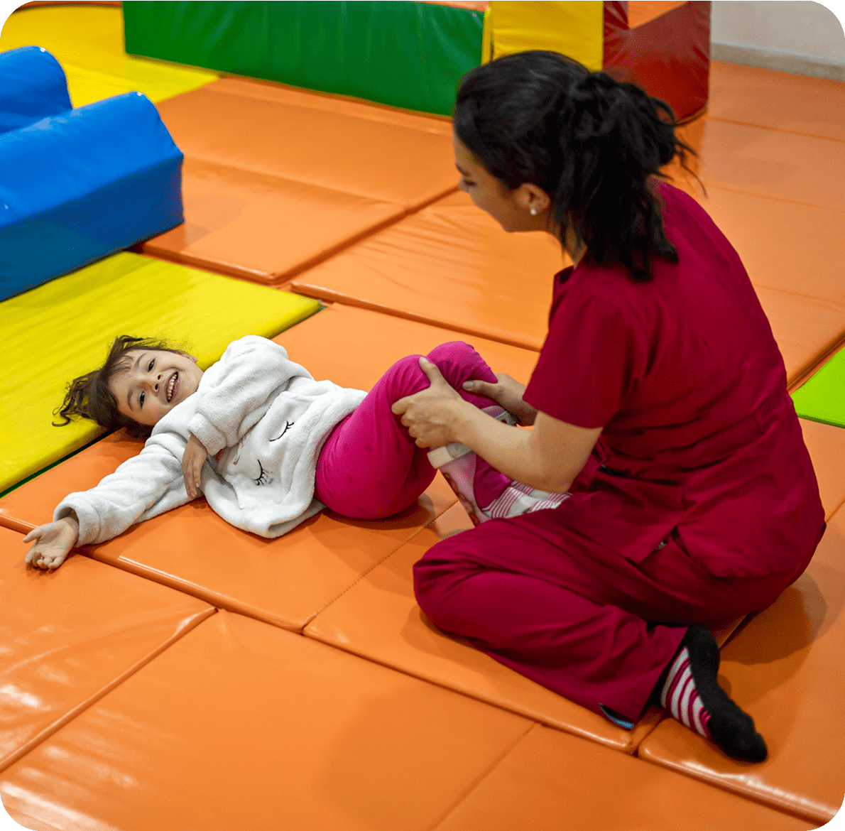 Therapist assisting child with exercise